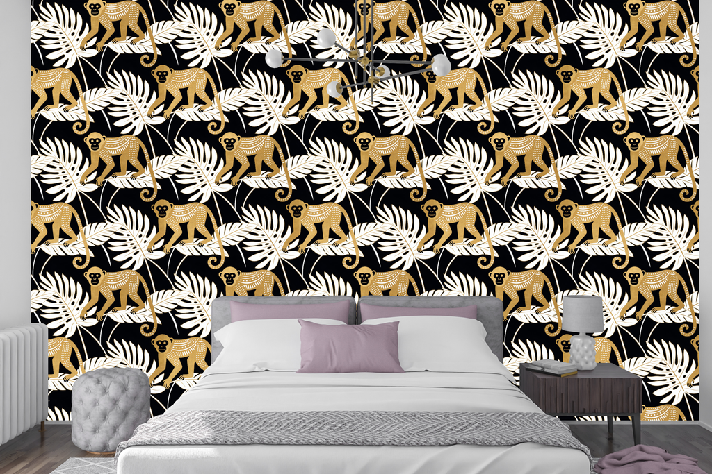 Black and gold jungle monkey wallpaper featuring stylised golden monkeys with tribal dot patterning, oversized white monstera fronds, banana leaves, and tropical palm foliage on a deep black ground — premium bold graphic tropical wallpaper by WallpaperPixi