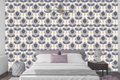 Calming slate blue and warm gray floral wallpaper creating a serene accent wall in a cozy bedroom