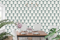Minimalist dark teal and cream Scandinavian botanical wallpaper in a modern dining room
