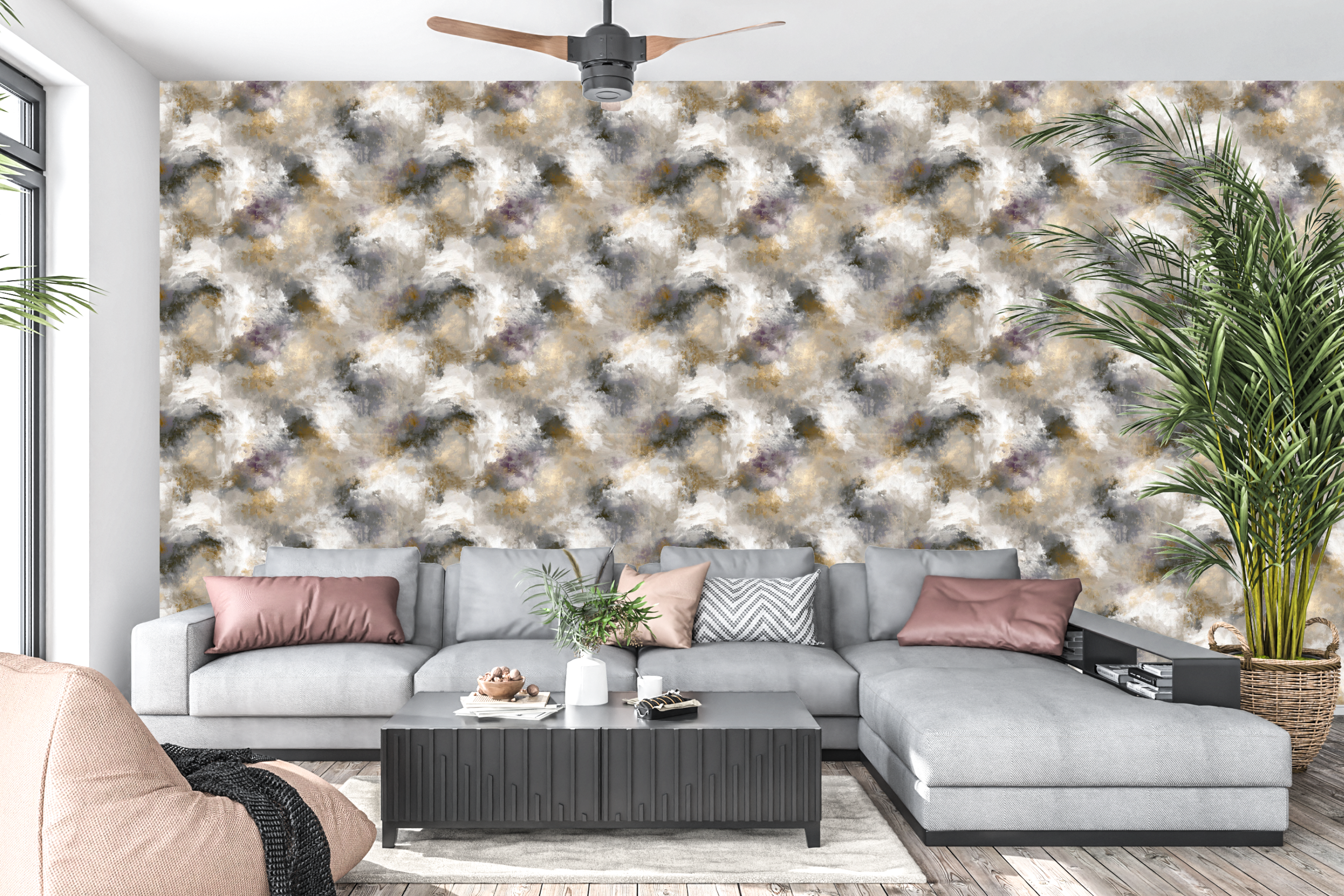 Moody abstract painted wall mural in gold and gray behind a stylish modern living room sofa