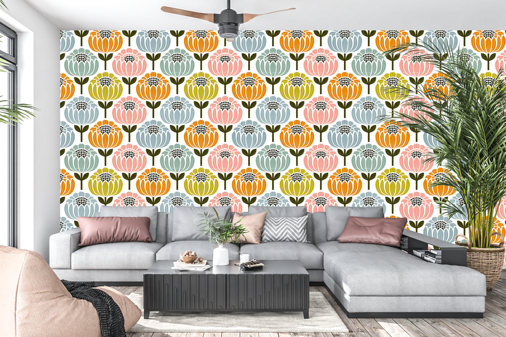 Vibrant retro geometric botanical peel and stick wall mural behind a modern living room sofa