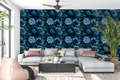 Dark gothic floral wallpaper with oversized blue blossoms and layered botanical petals on a black background