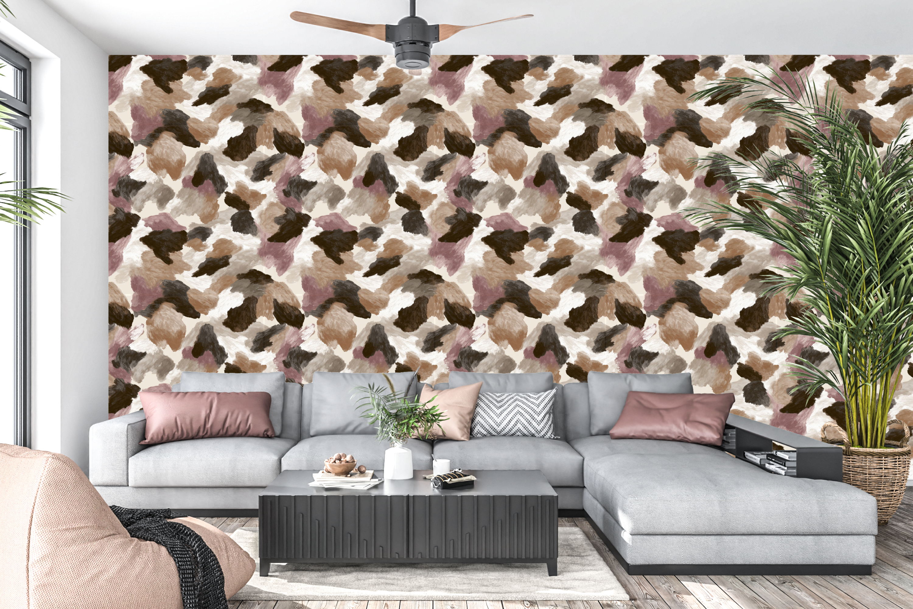 Boho chic brushstroke animal print peel and stick wall mural behind a stylish living room sofa