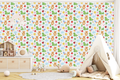 Seamless crayon doodle wallpaper with green dinosaur and purple rocket in a colorful playroom