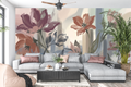 Modern impressionist terracotta and blue botanical peel and stick wall mural behind a stylish sofa