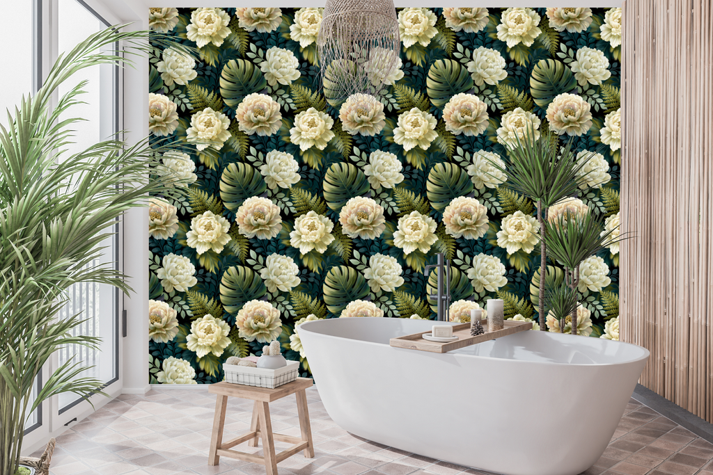 Dark tropical peony wallpaper styled as an atmospheric bedroom feature wall with cream velvet headboard, brass lighting, and warm linen bedding — peel and stick or traditional paste moody wallpaper by WallpaperPixi