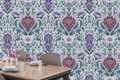 Purple botanical damask wallpaper featuring a large dusty mauve protea bloom, soft violet cosmos flowers, periwinkle cornflowers, pale daisy, and sweeping teal-green acanthus leaves on a cool lavender-grey ground — premium floral wallpaper by WallpaperPixi