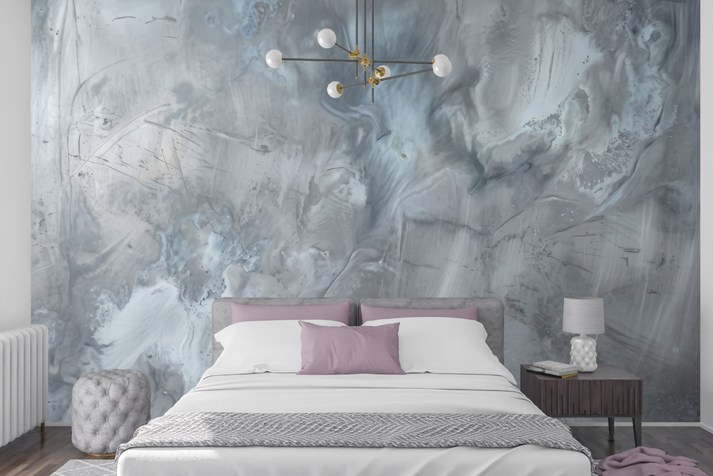 Distressed silver and grey faux plaster peel and stick wallpaper behind a sleek bed