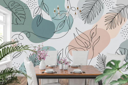 Pastel organic shapes and leaf line drawing peel and stick wallpaper behind a home office desk