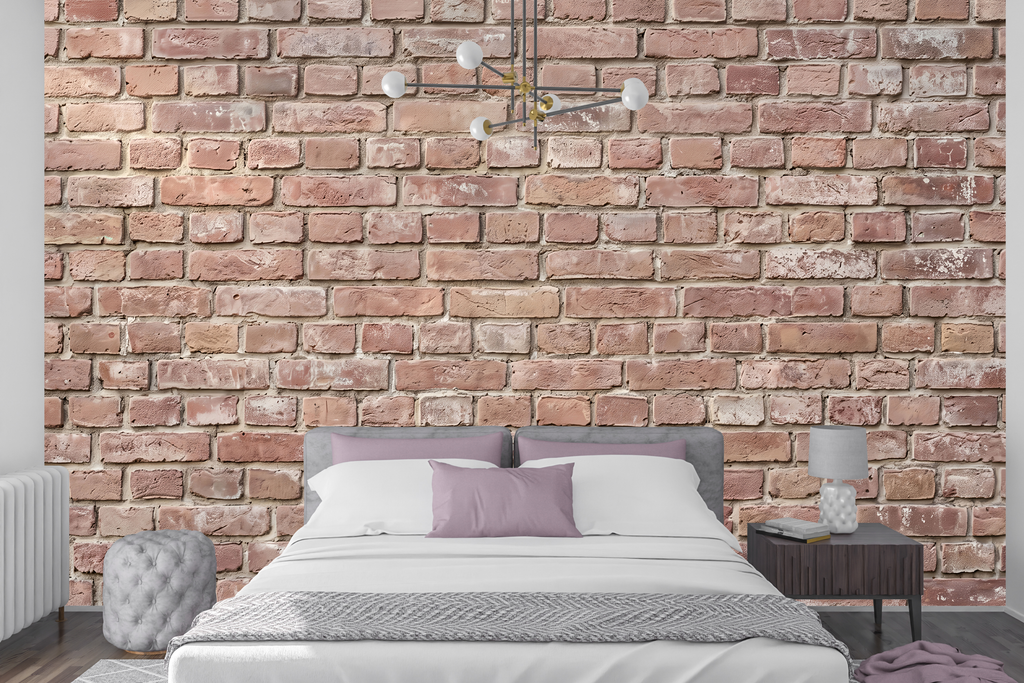 Seamless exposed brick peel and stick wallpaper behind a modern bed