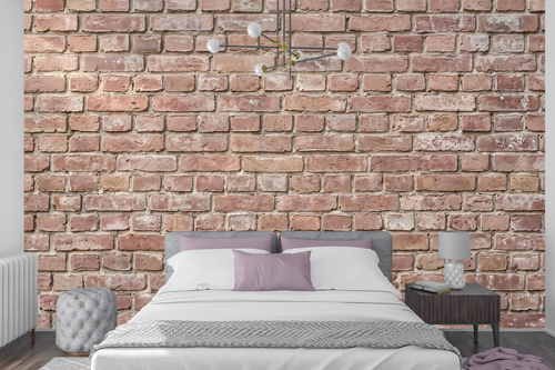 Seamless exposed brick peel and stick wallpaper behind a modern bed