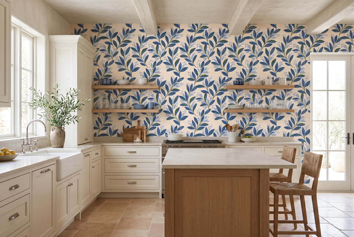 Repeating blue leaf wallpaper pattern on a warm ivory background