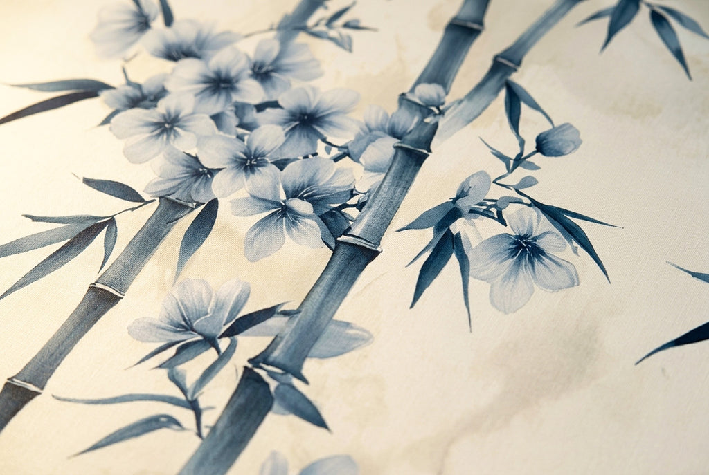 Close-up detail of blue and white chinoiserie wallpaper mural showing watercolour bamboo stems cherry blossoms and delicate brushstrokes
