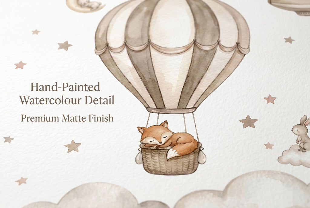 Close up detail of hot air balloon nursery wallpaper showing sleeping fox in basket with soft watercolour clouds
