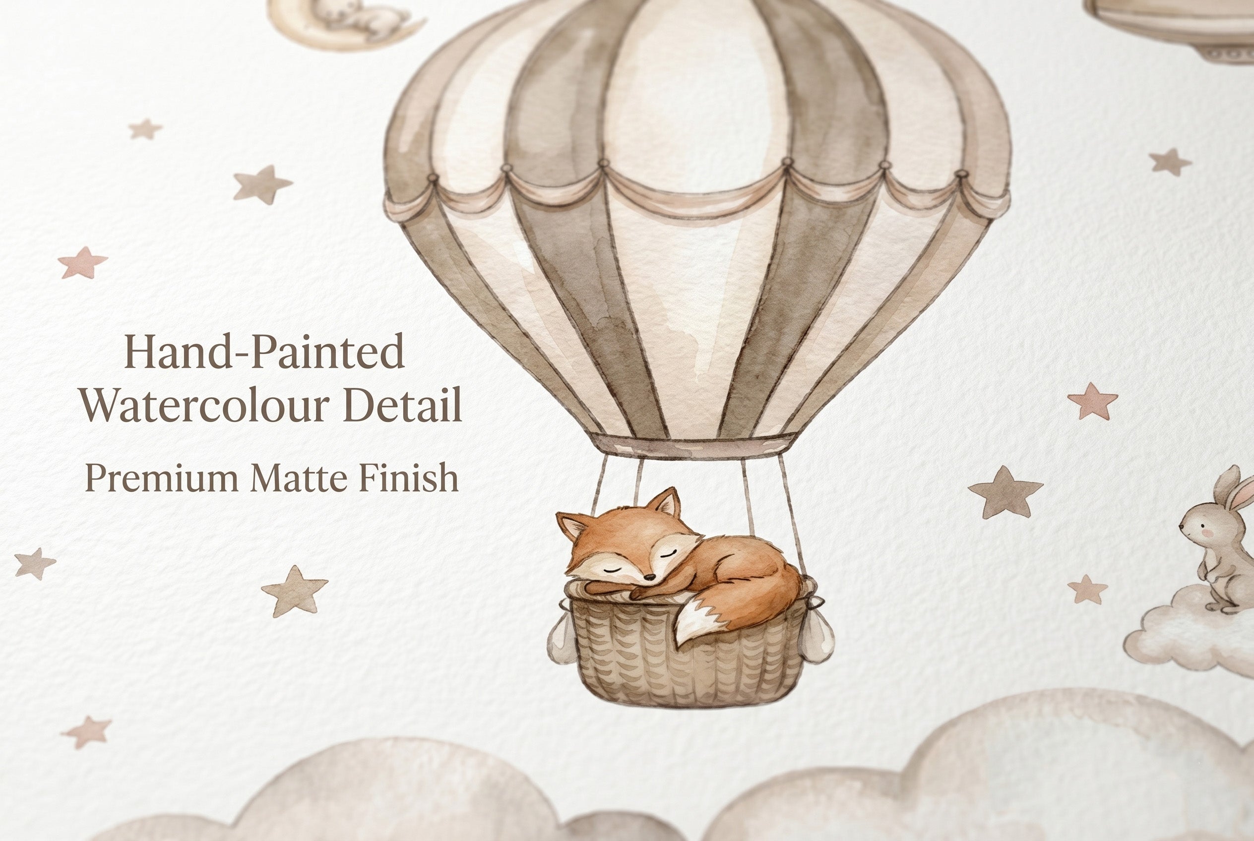 Close up detail of hot air balloon nursery wallpaper showing sleeping fox in basket with soft watercolour clouds