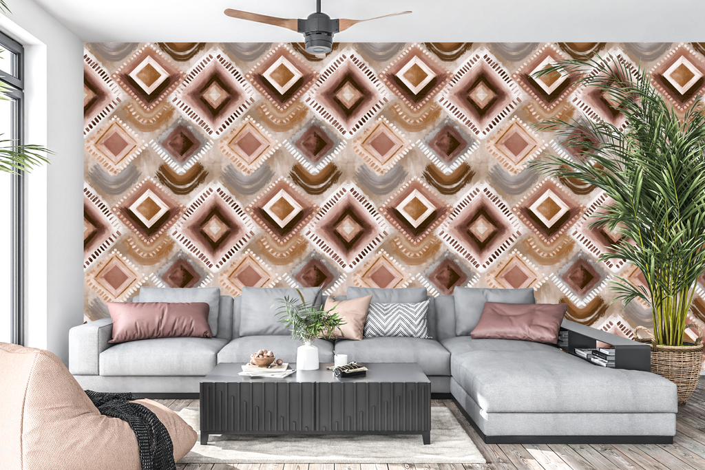 Soft painterly terracotta and brown geometric peel and stick wall mural behind a boho living room sofa