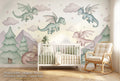 Pastel baby dragon wall mural accent wall in a bright gender-neutral nursery with a white wooden crib sage green bedding and warm natural light