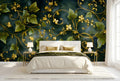 Dark green and gold ivy botanical wall mural accent wall in a bright glamorous bedroom with a white upholstered bed cream bedding and gold accents