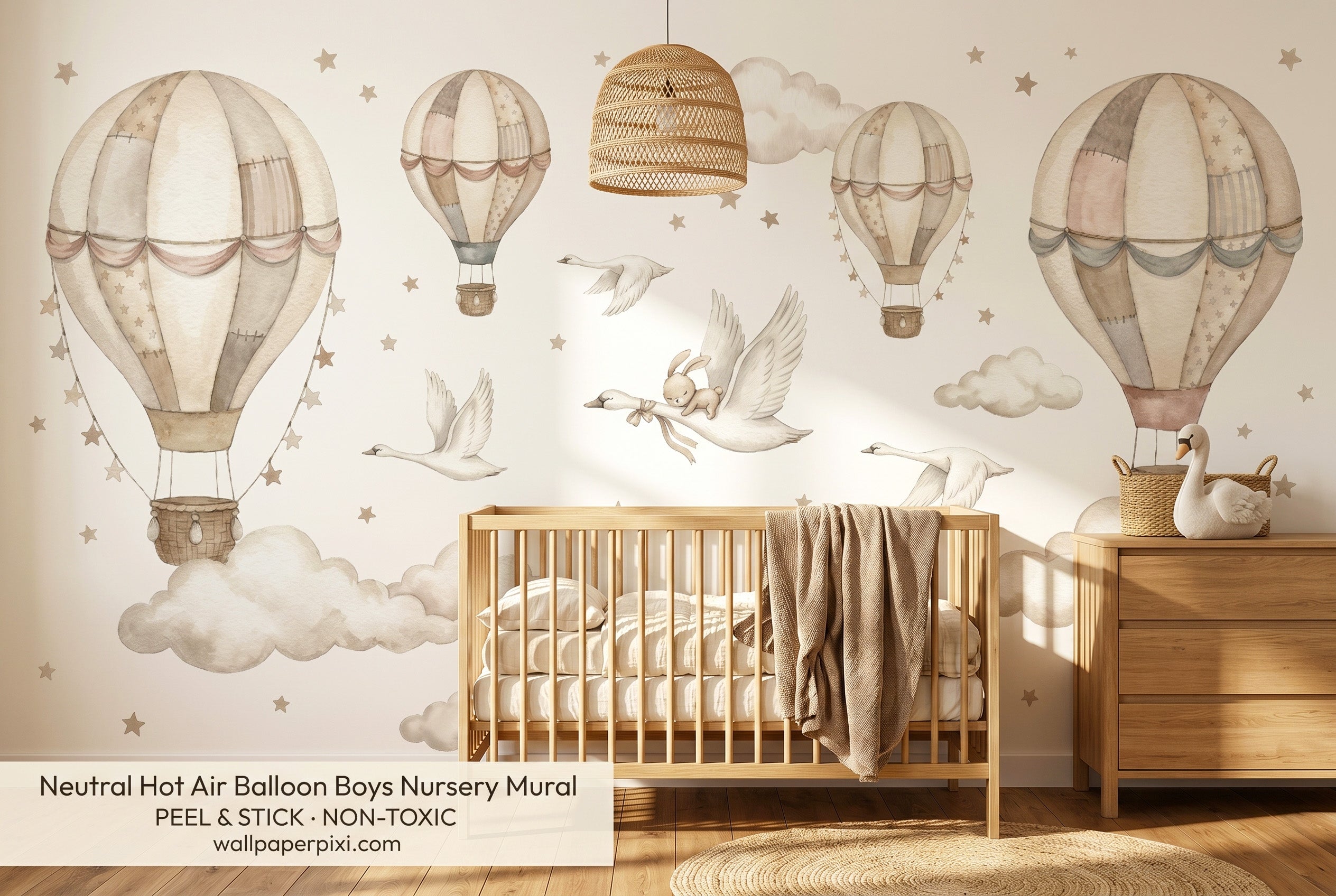Watercolour hot air balloon nursery mural in a bright neutral boys nursery with a natural oak crib cream bedding and woven storage baskets