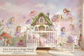 Fairy garden mushroom cottage wall mural in a bright dreamy girls nursery with a white crib blush and lavender bedding warm natural light and fairy lights