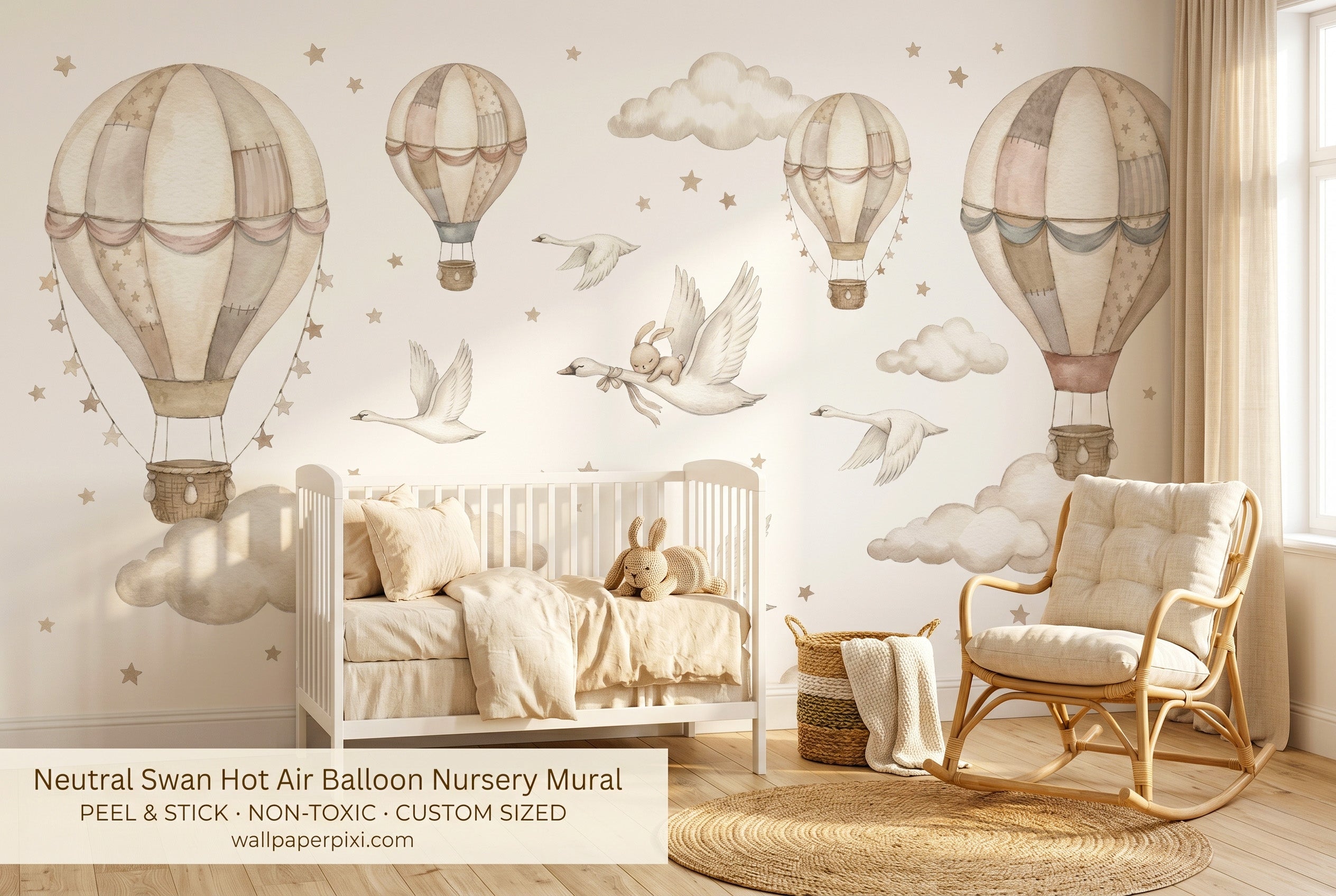 Neutral swan hot air balloon wall mural in a bright gender-neutral nursery with a white crib warm beige bedding rattan rocking chair and natural wood accessories