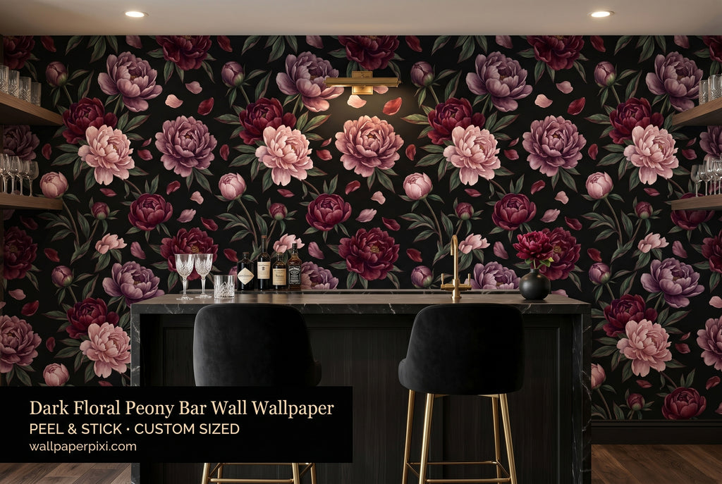 Dark floral black peony wallpaper in a bright moody home bar with dark marble counter brass fixtures velvet bar stools and warm ambient lighting