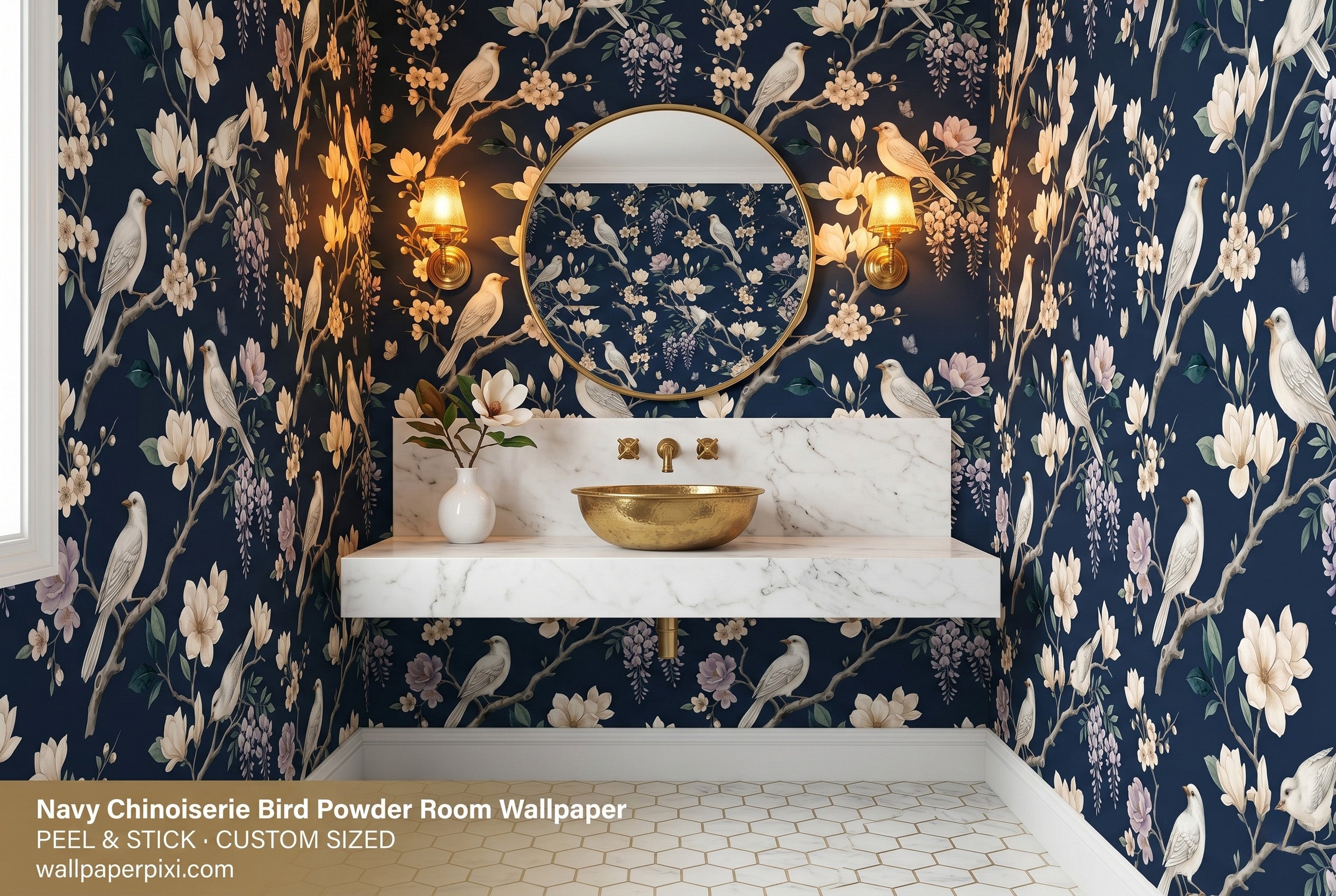 Navy chinoiserie bird blossom wallpaper in a bright powder room with a white marble vanity brass fixtures and a round gold mirror