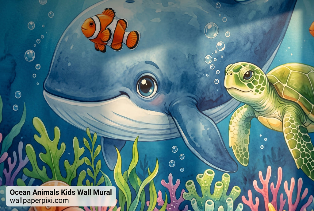 Close-up detail of ocean animals wall mural showing blue whale face clownfish green sea turtle and coral reef in vibrant watercolour detail.
