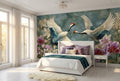 Japanese crane wall mural accent wall in a bright elegant bedroom with a white upholstered bed teal and purple accent cushions and warm natural light