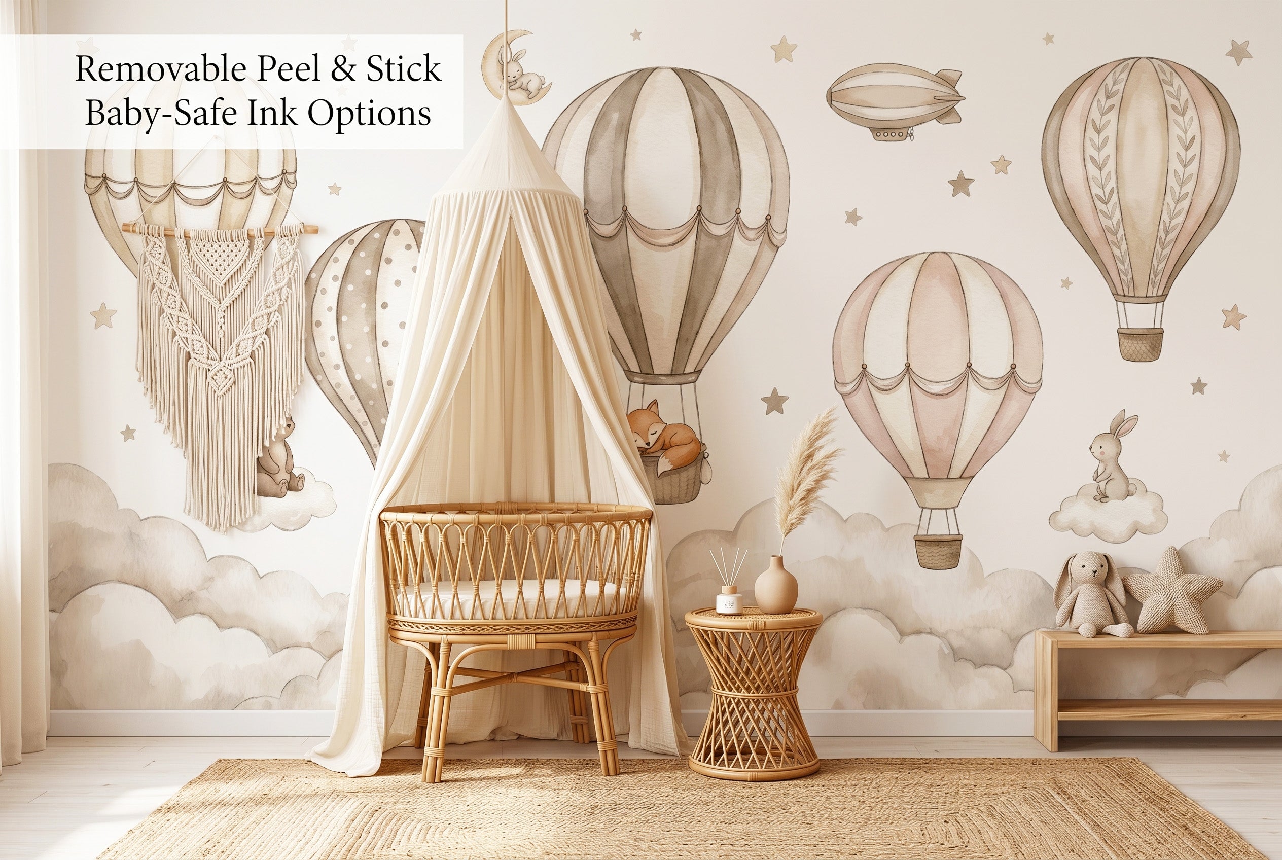 Hot air balloon nursery peel and stick wallpaper mural in a boho nursery with rattan crib and macrame decor