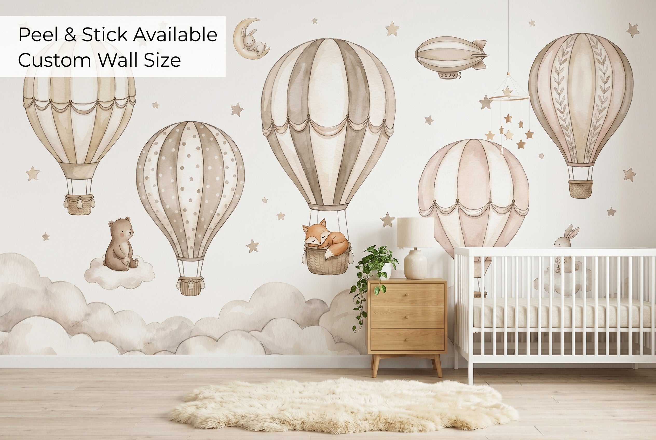 Hot air balloon nursery wallpaper mural in a Scandinavian minimal baby room with natural wood and cream tones