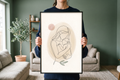 Detail view showing the crisp continuous line drawing of a mother's embrace and soft textured watercolor shapes