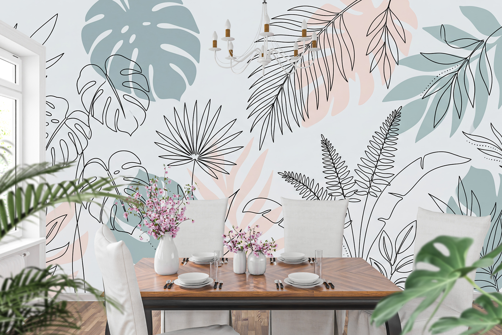 Pastel blush and sage green monstera peel and stick wallpaper behind a home office desk