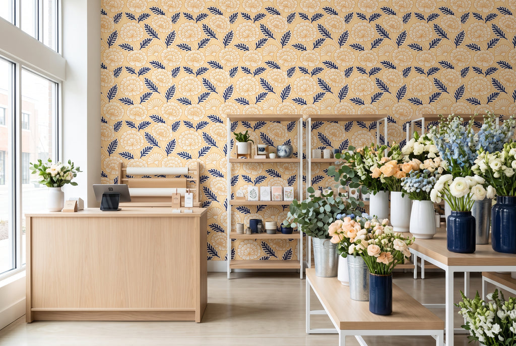 Bold navy blue leaf wallpaper with graphic yellow and cream floral details