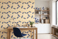 Navy blue and yellow floral wallpaper with oversized cream flowers and bold leaves