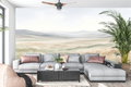 Serene watercolor meadow mural in a minimalist neutral Japandi living room