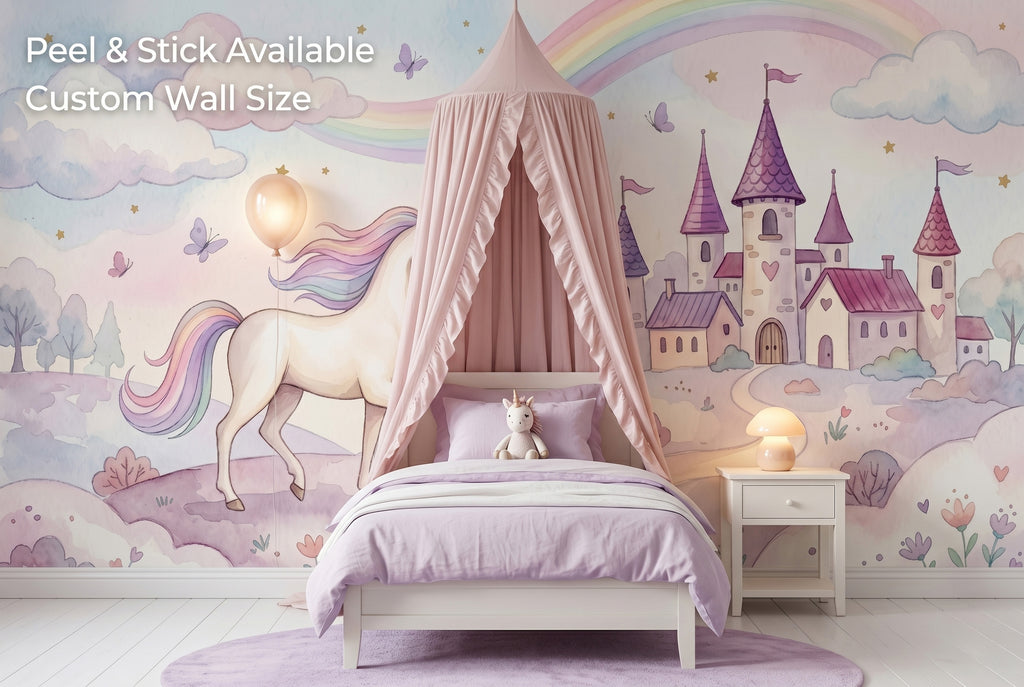 Unicorn rainbow castle wall mural spanning the full feature wall of a maximalist girls bedroom — the panoramic fairy tale scene behind a white bed with pink velvet headboard, pastel rainbow bedding and a white bookshelf with unicorn figurines.