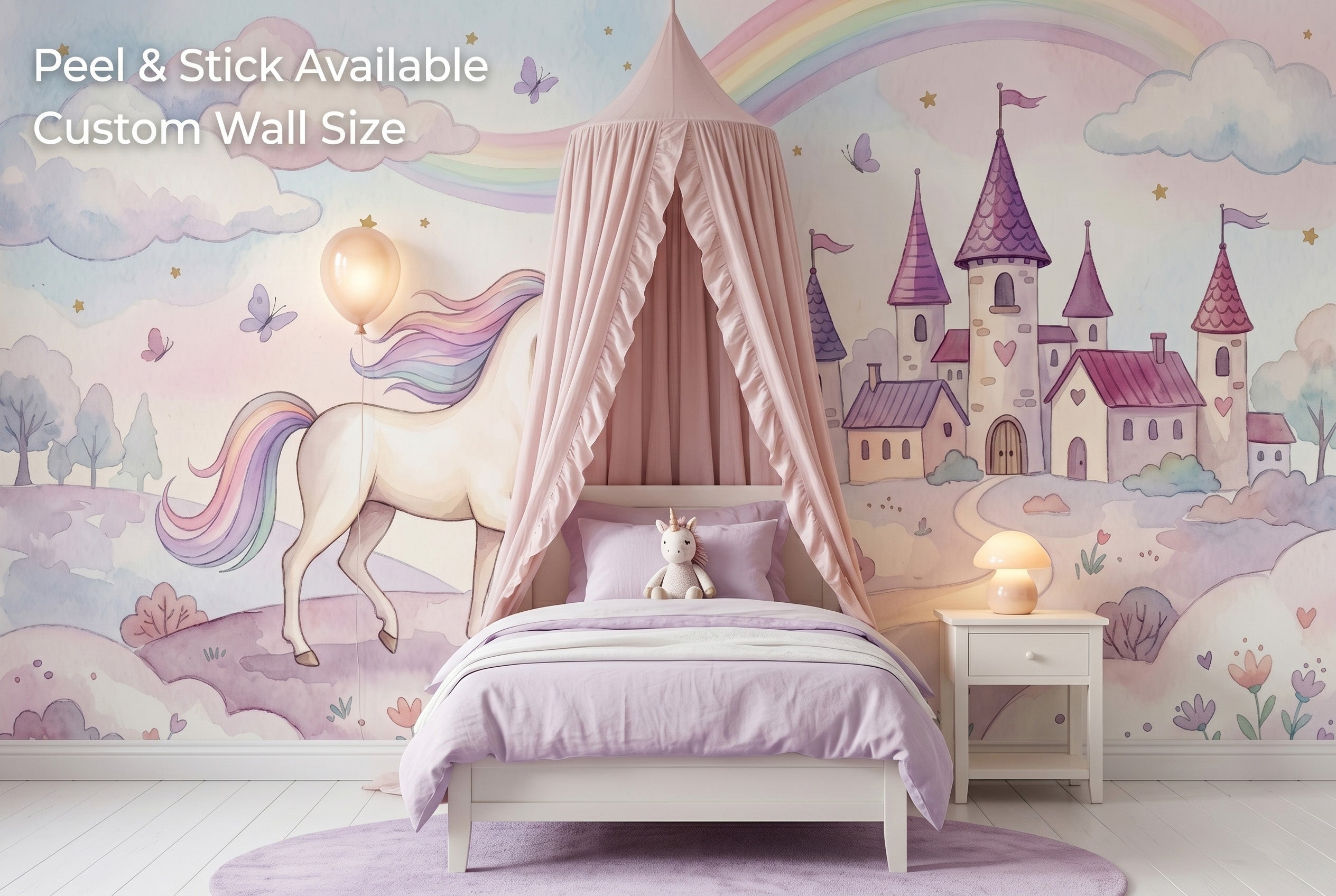 Unicorn rainbow castle wall mural spanning the full feature wall of a maximalist girls bedroom — the panoramic fairy tale scene behind a white bed with pink velvet headboard, pastel rainbow bedding and a white bookshelf with unicorn figurines.