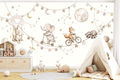 Whimsical star garland and swinging bunny mural creating a magical playroom wall