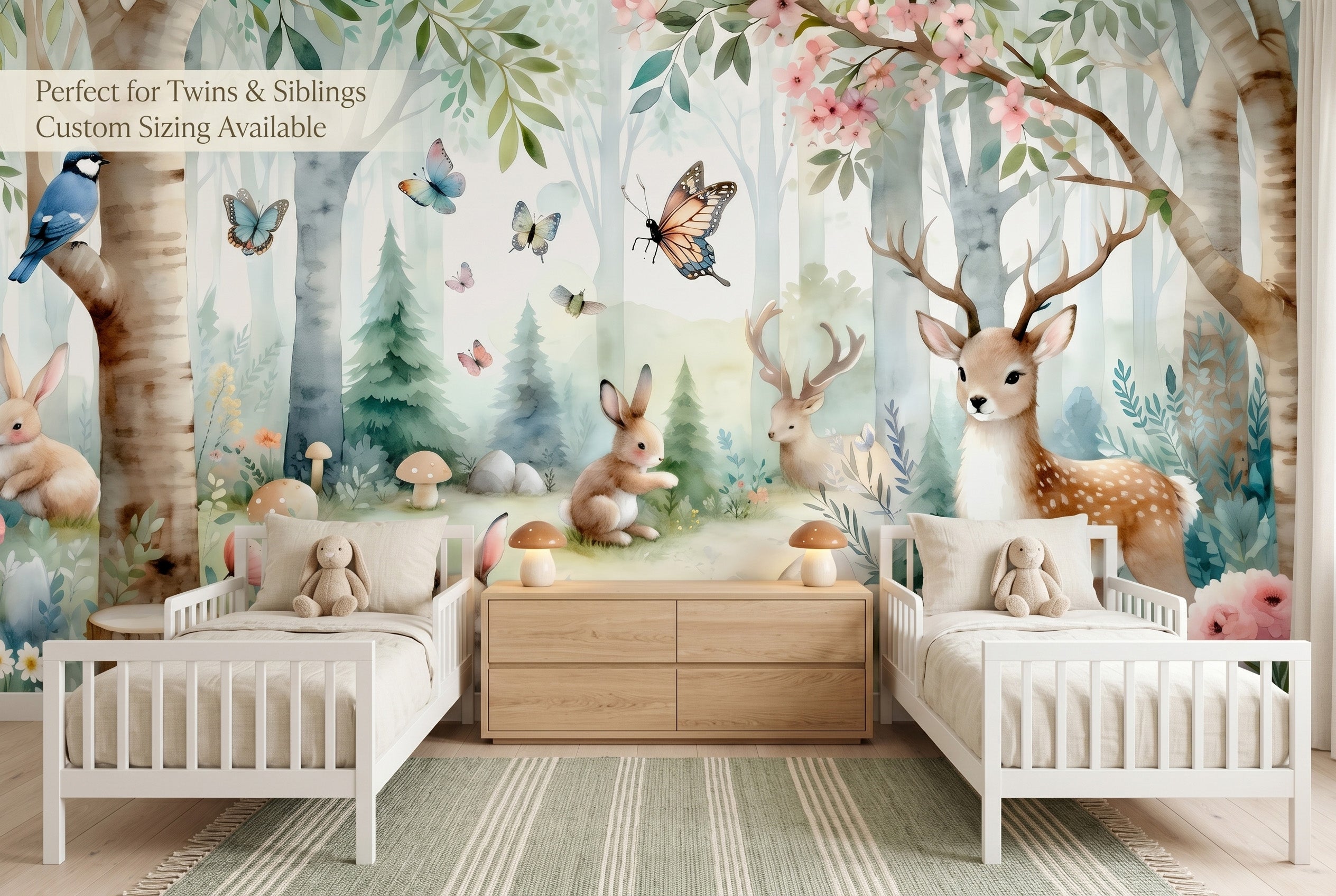 Watercolour woodland animal nursery wallpaper mural in a gender neutral twin toddler room with two white cribs and birch tree design