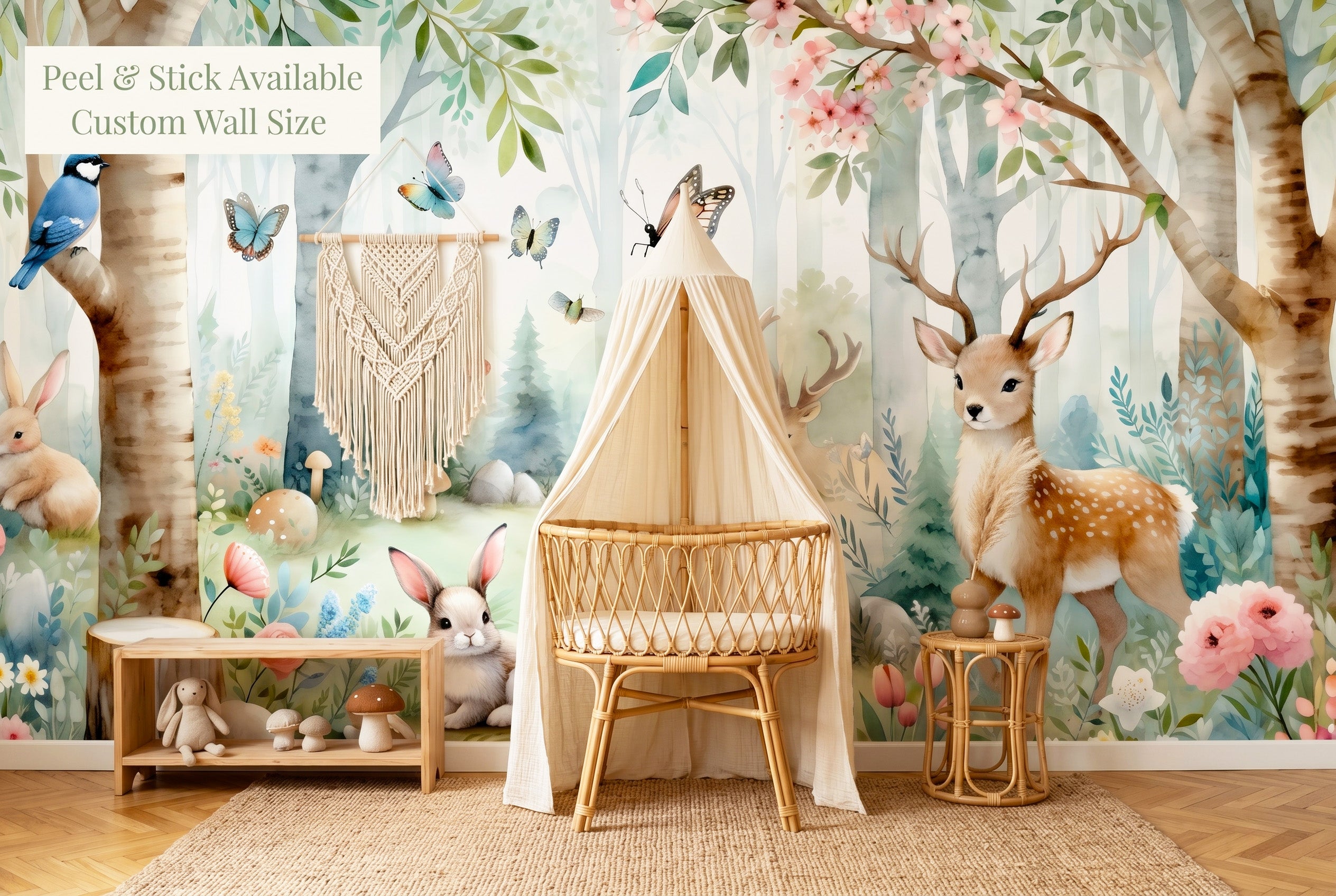 Woodland nursery wallpaper mural with deer rabbits and birch trees in a boho nursery with rattan crib and macramé decor